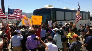 Protesters-block-immigration-bus-jpg